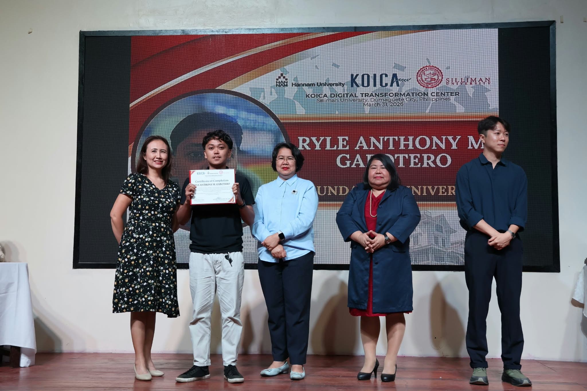 Ryle receiving a KOICA certificate